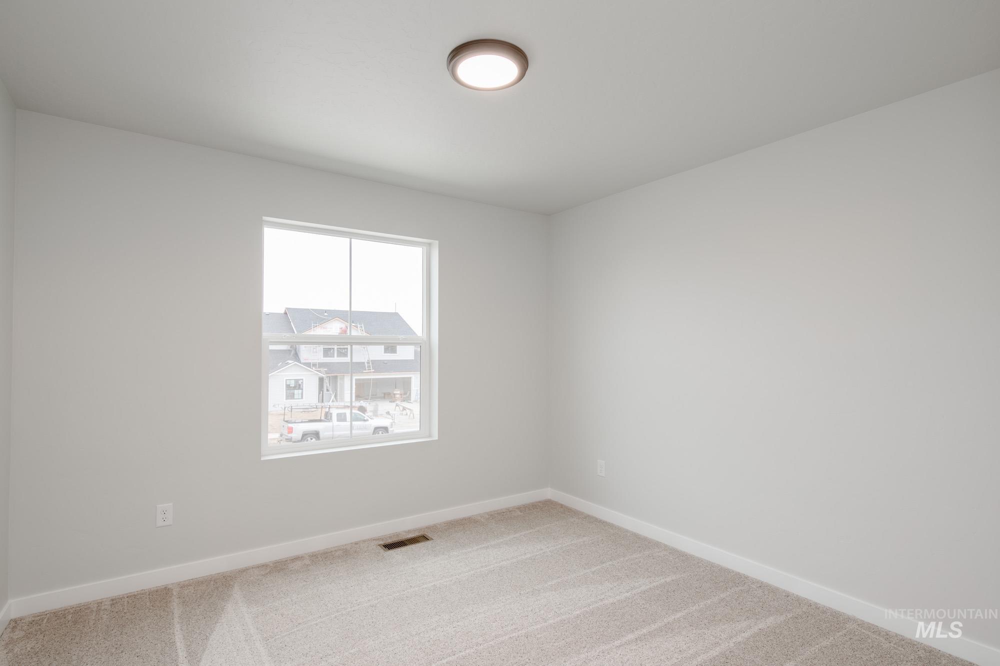 1494 Long Pond Street Middleton, ID 83644 - Photo 19 of 24 Empty room with baseboards and carpet floors