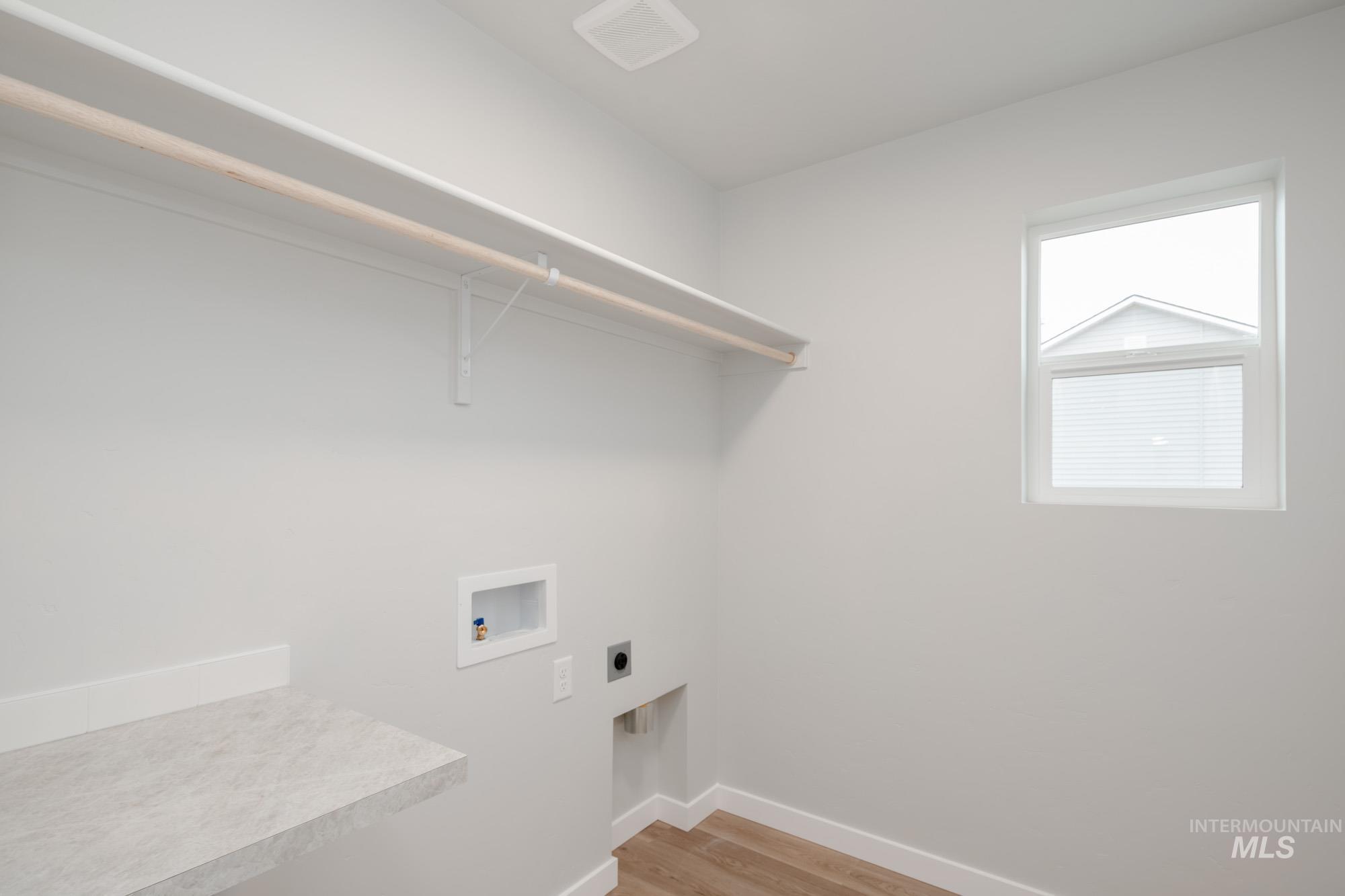 1494 Long Pond Street Middleton, ID 83644 - Photo 20 of 24 Laundry room with light wood-style floors, hookup for a washing machine, and electric dryer hookup