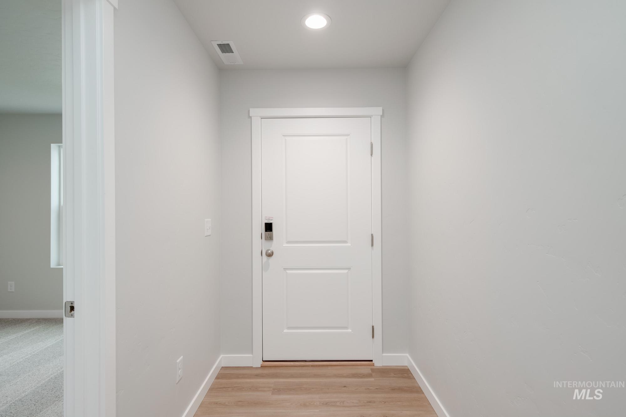 1494 Long Pond Street Middleton, ID 83644 - Photo 3 of 25 Doorway to outside featuring recessed lighting and wood finished floors