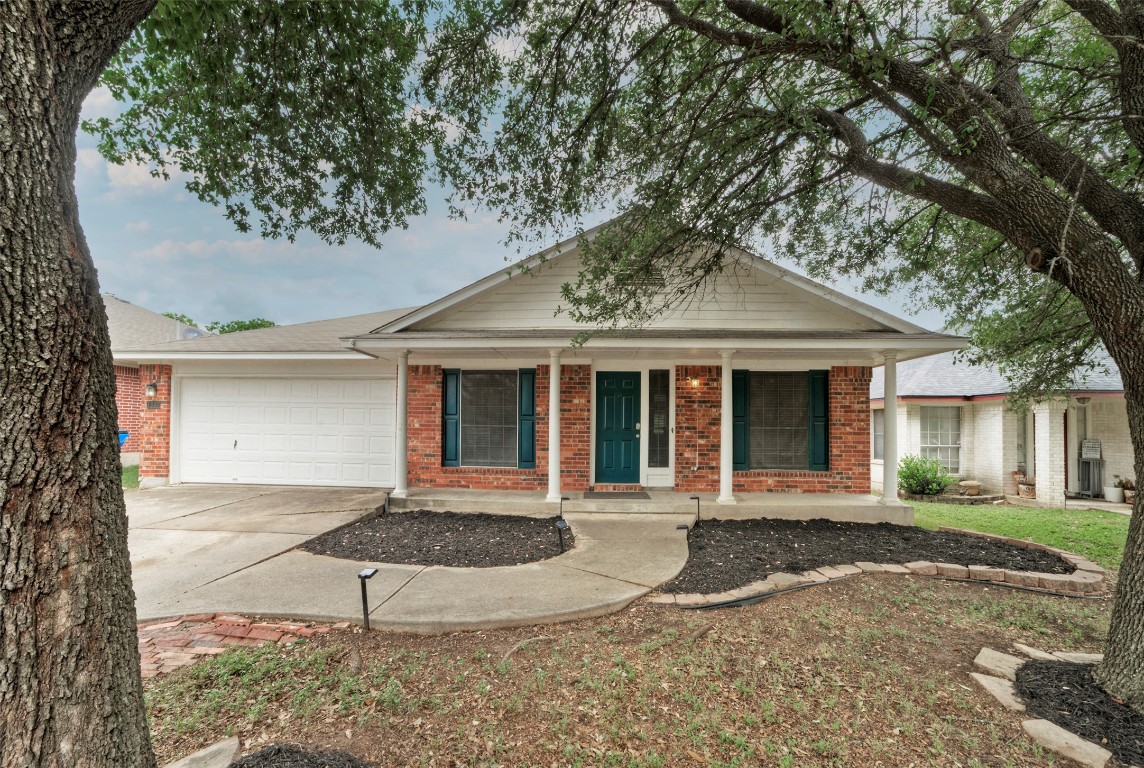 front view of a house with a trees