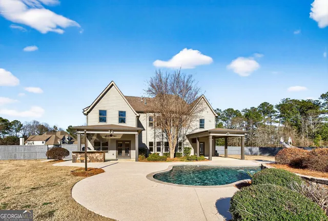 a view of staircase with wooden floor and white walls