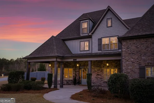 a front view of a house with garden