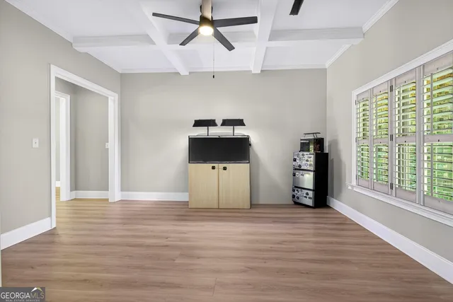 a bathroom with a shower sink vanity mirror and toilet