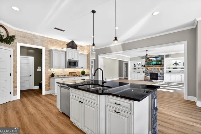 a view of a house with backyard porch and sitting area