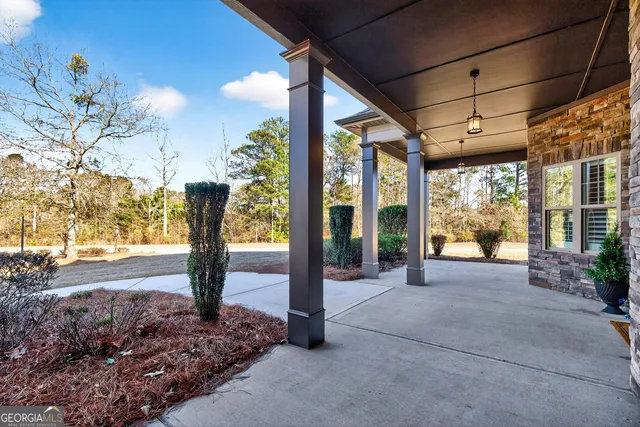 a view of a swimming pool with a patio
