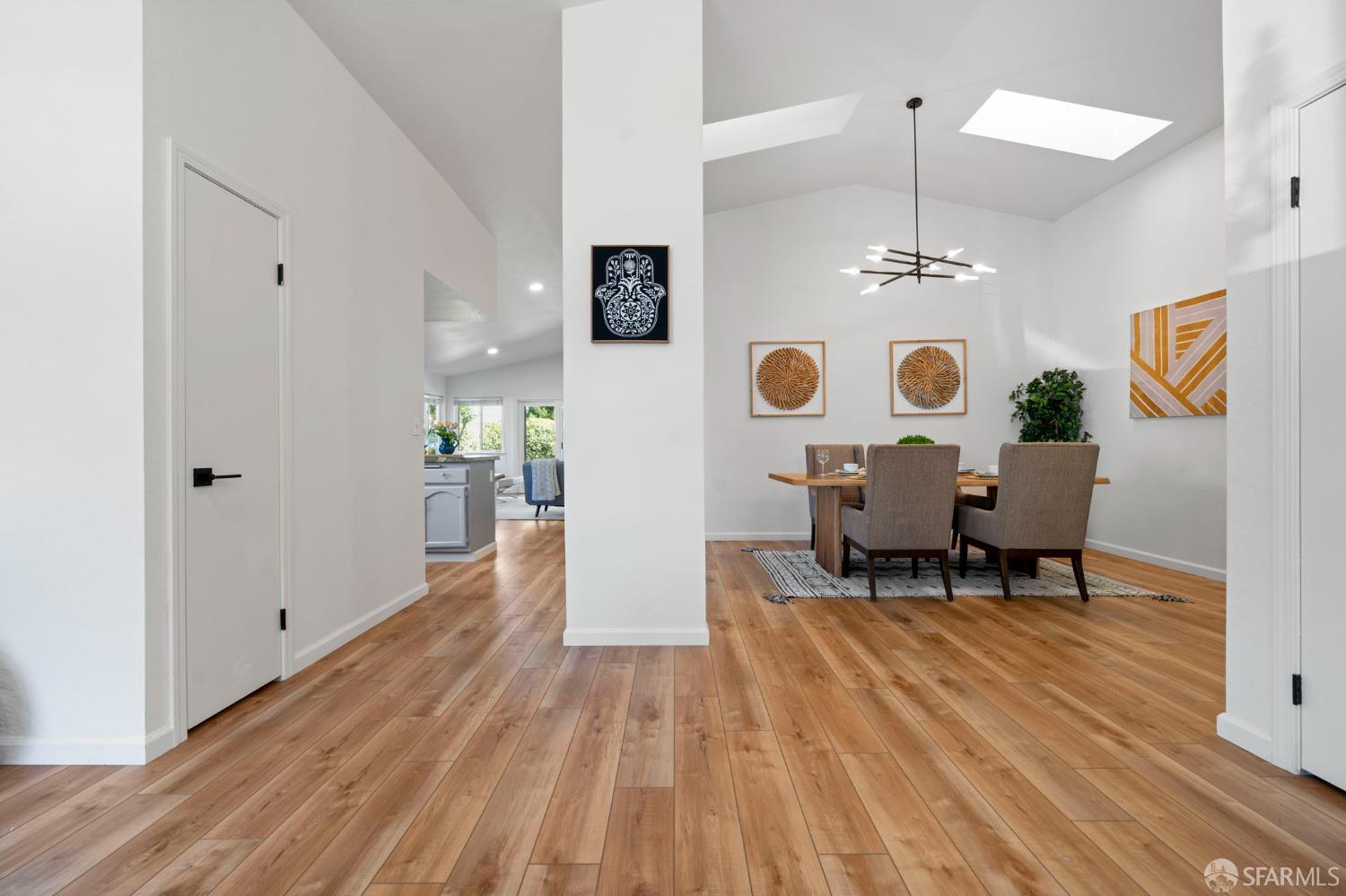 1806 Evalane Way Concord, CA 94519 - Photo 14 of 81 a view of dining room and livingroom with furniture wooden floor a chandelier
