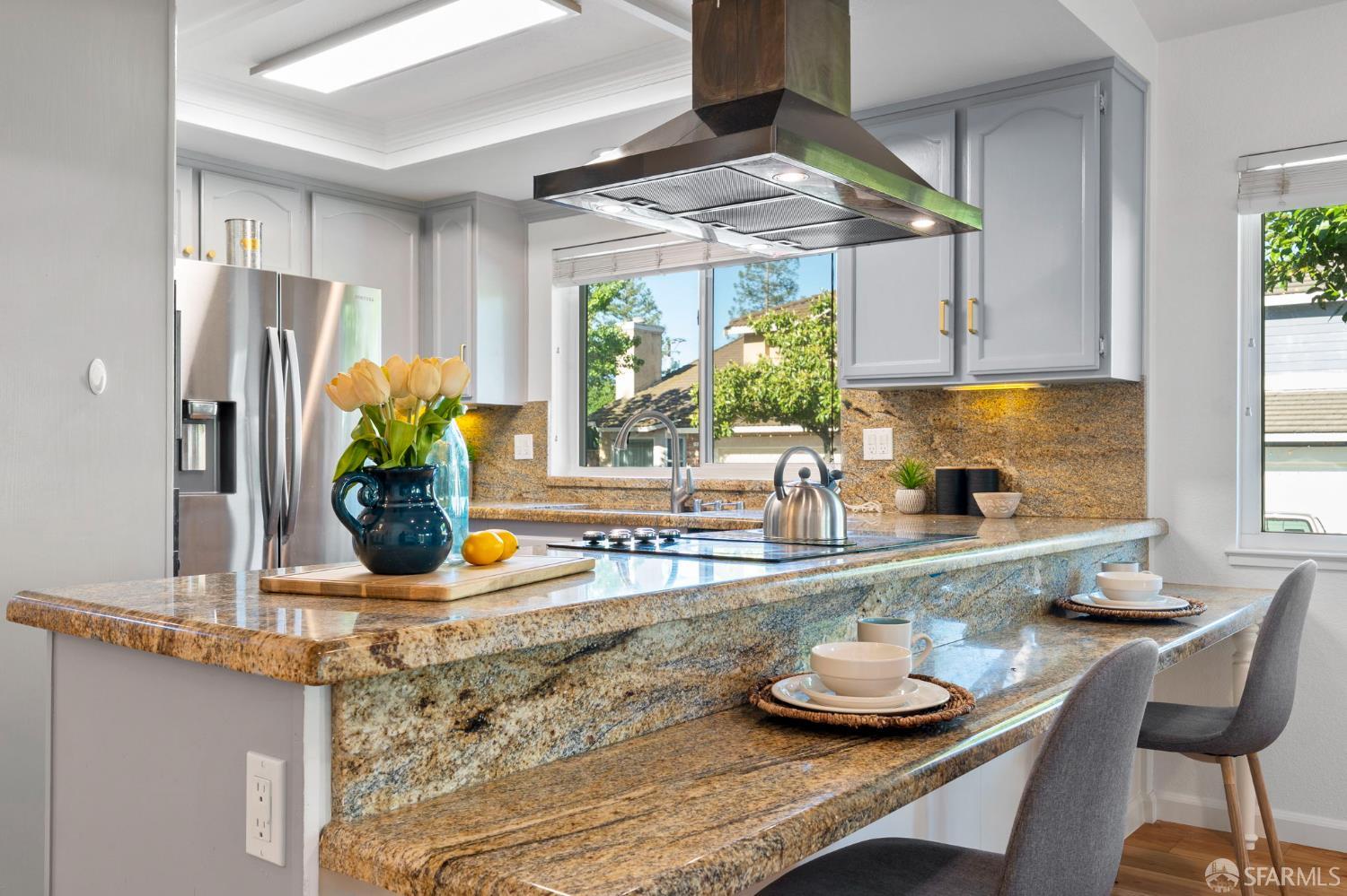 1806 Evalane Way Concord, CA 94519 - Photo 22 of 81 a kitchen with stainless steel appliances granite countertop a sink a refrigerator and a wooden cabinets