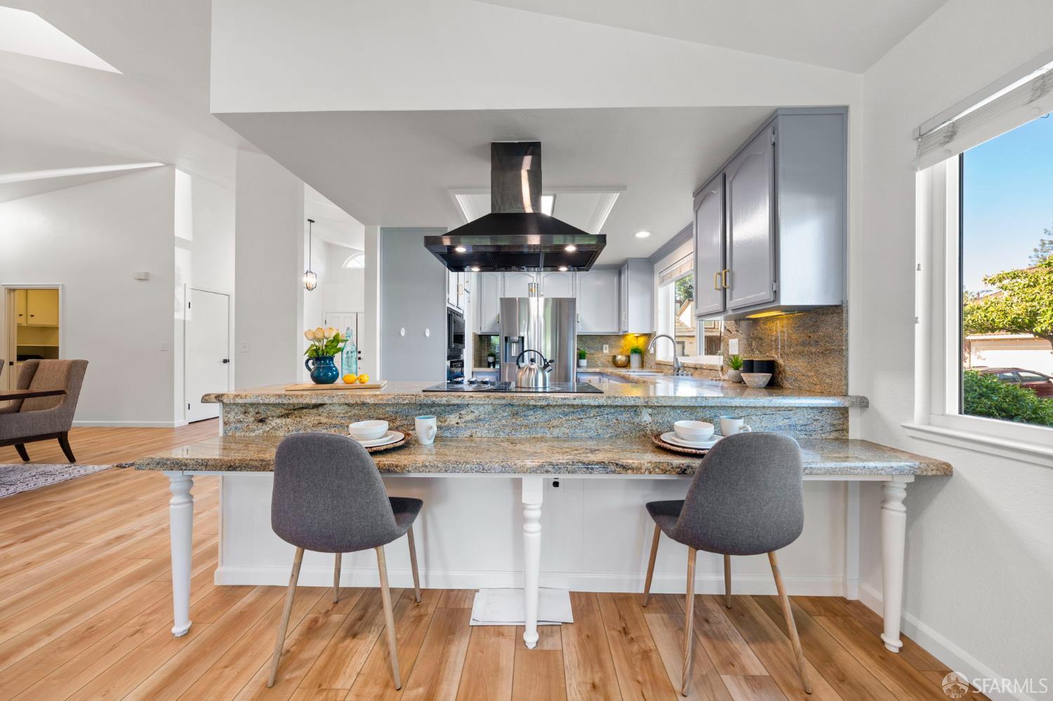 1806 Evalane Way Concord, CA 94519 - Photo 24 of 81 a kitchen with stainless steel appliances granite countertop a stove a sink a dining table and chairs