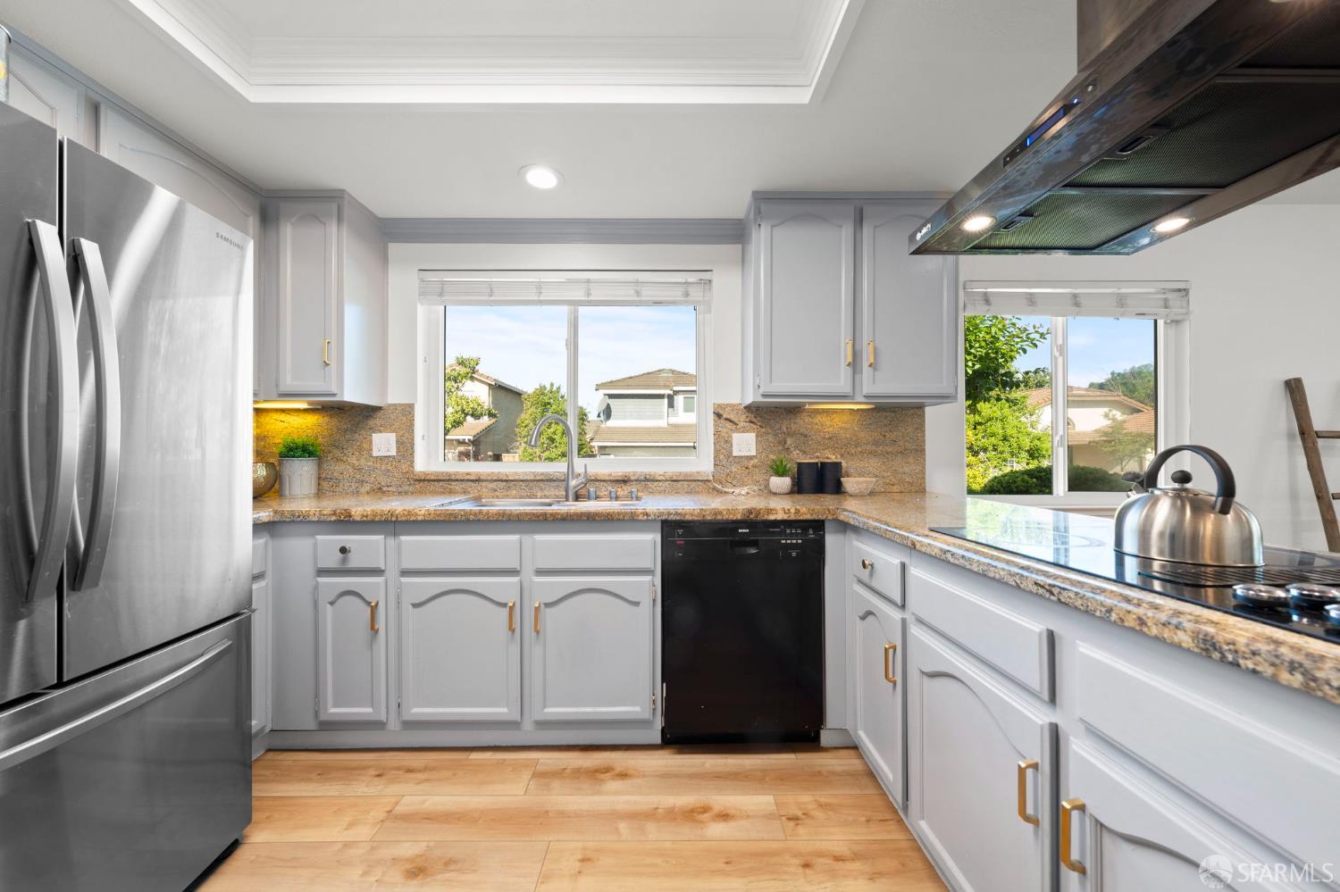1806 Evalane Way Concord, CA 94519 - Photo 26 of 81 a kitchen with stainless steel appliances granite countertop a sink window and cabinets