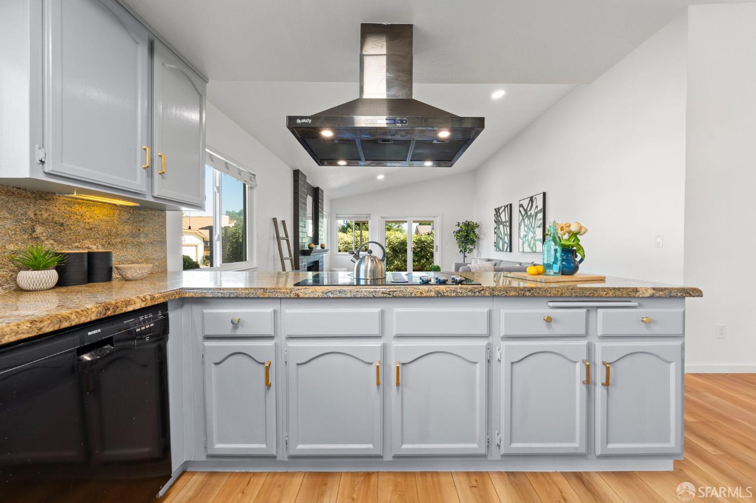 1806 Evalane Way Concord, CA 94519 - Photo 27 of 81 a kitchen with white cabinets and chandelier
