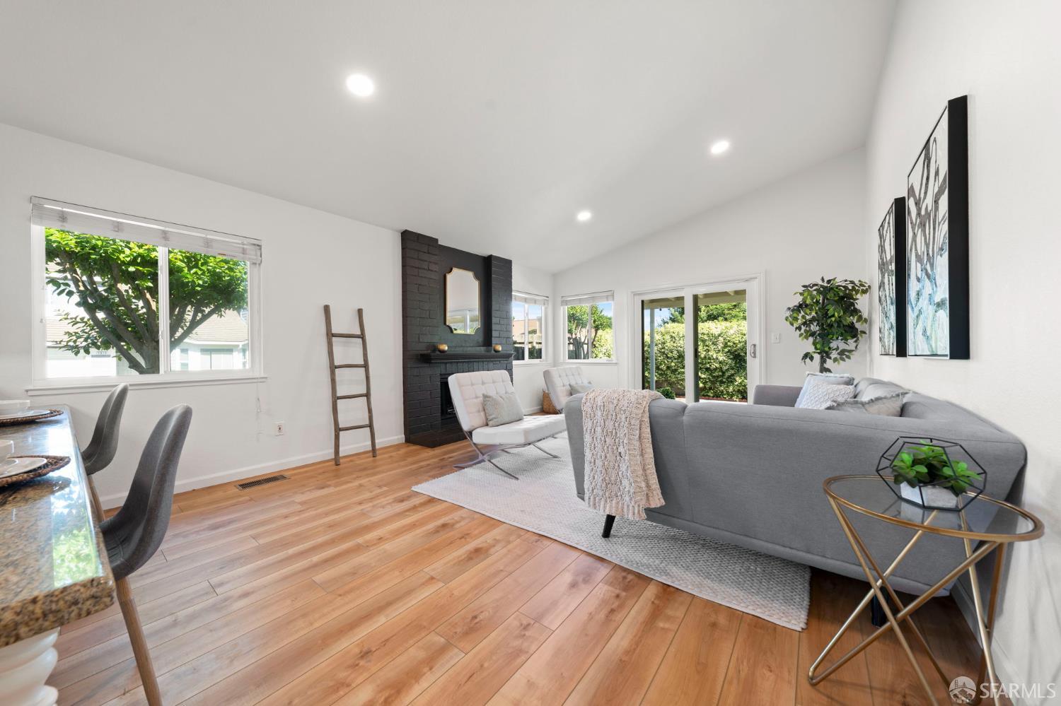 1806 Evalane Way Concord, CA 94519 - Photo 30 of 81 a living room with furniture a large window and wooden floor