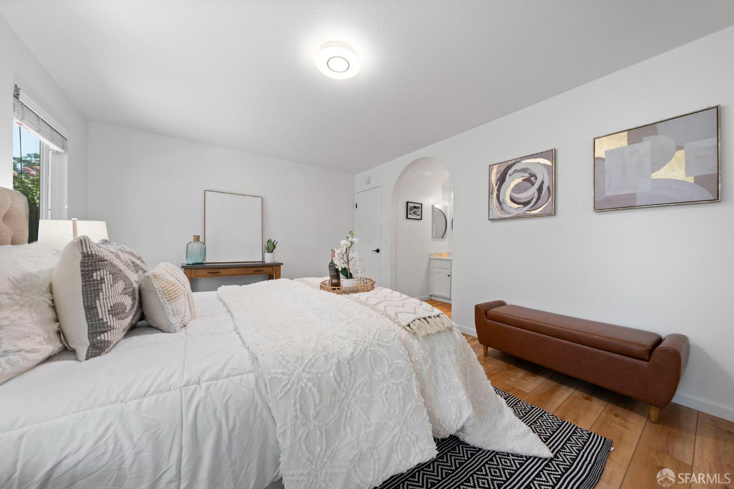 1806 Evalane Way Concord, CA 94519 - Photo 58 of 81 a bedroom with a bed and wooden floor