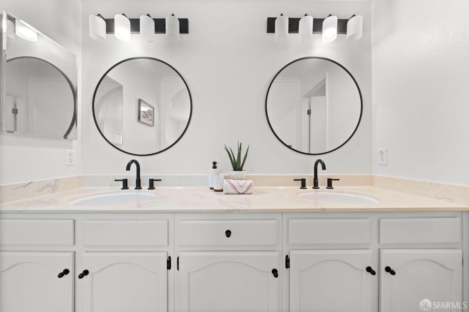 1806 Evalane Way Concord, CA 94519 - Photo 60 of 81 a bathroom with a granite countertop double vanity sinks and a mirror