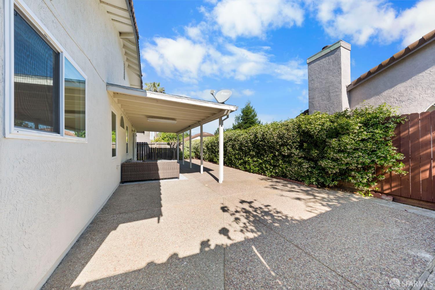 1806 Evalane Way Concord, CA 94519 - Photo 67 of 81 a view of a patio with couches and table and chairs under an umbrella