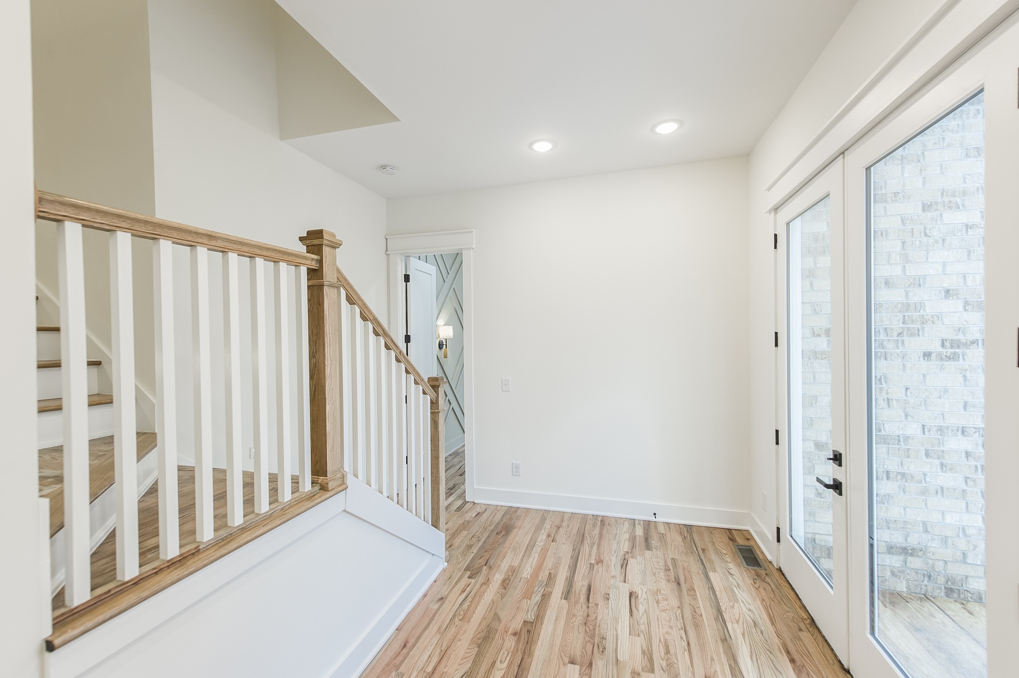 2026 Beaver Ridge Road Burns, TN 37029 - Photo 14 of 45 a view of a hallway with wooden floor and staircase