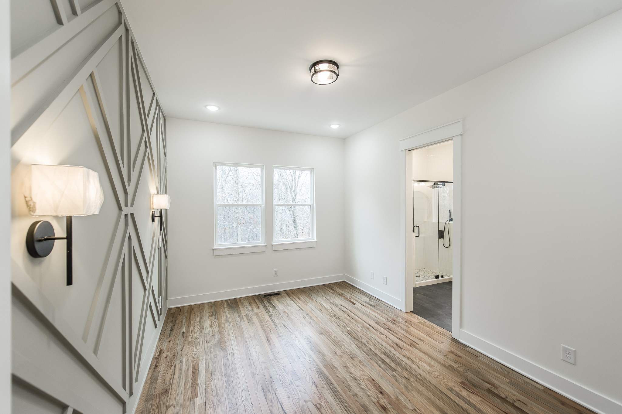 2026 Beaver Ridge Road Burns, TN 37029 - Photo 17 of 45 a view of empty room with wooden floor and fan
