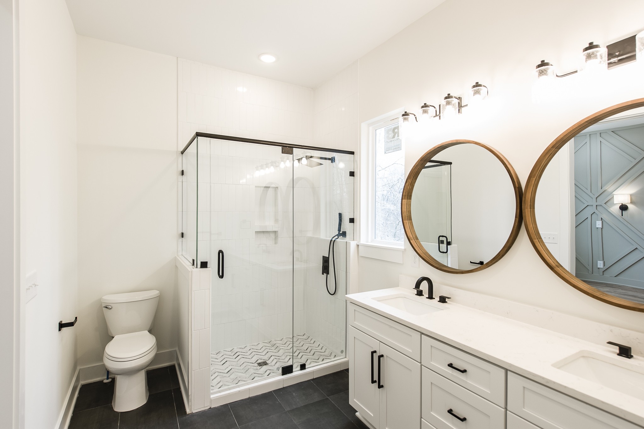 2026 Beaver Ridge Road Burns, TN 37029 - Photo 19 of 45 a bathroom with a toilet a sink a mirror and a shower