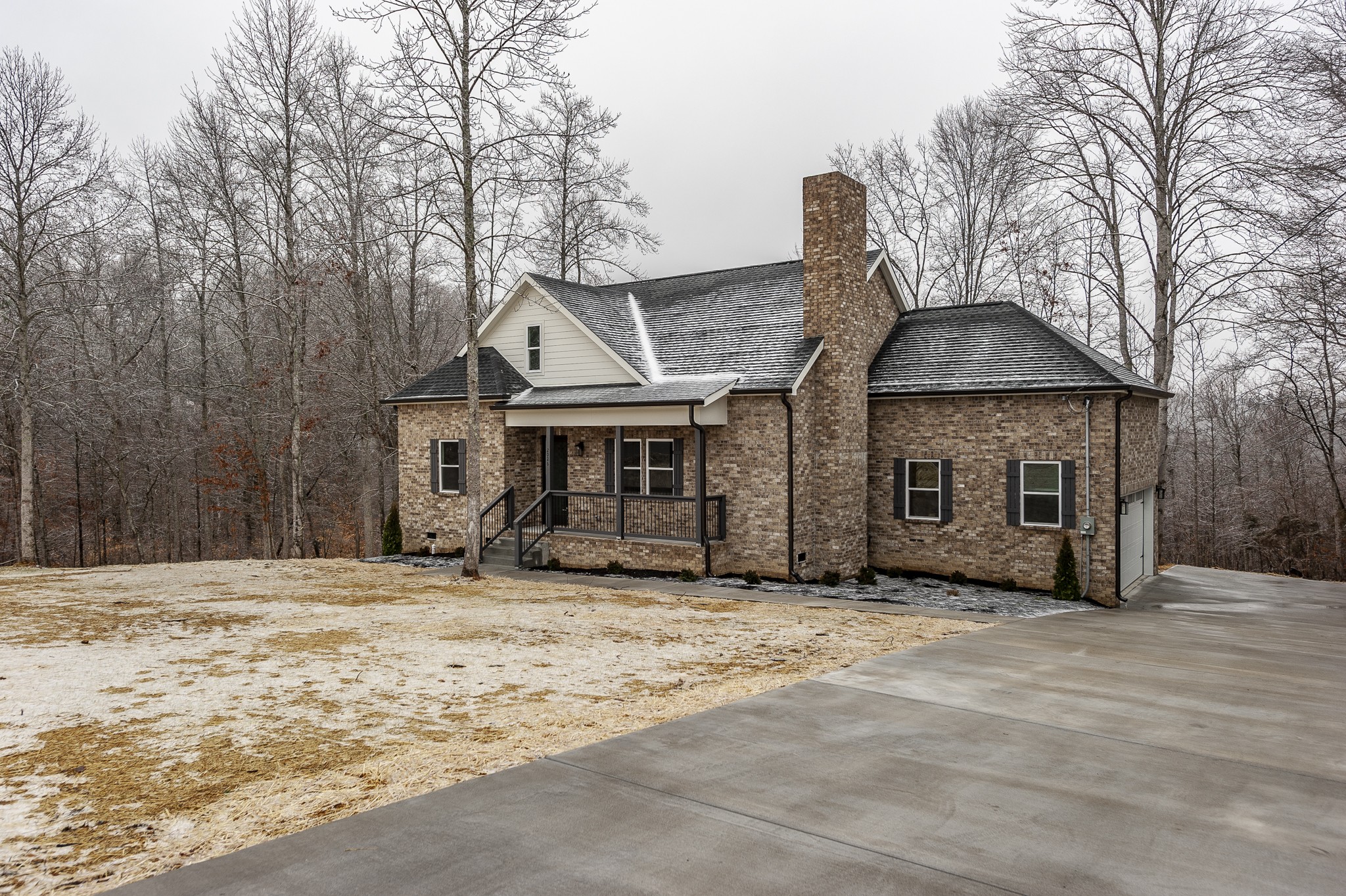 2026 Beaver Ridge Road Burns, TN 37029 - Photo 2 of 45 a front view of a house with yard and trees