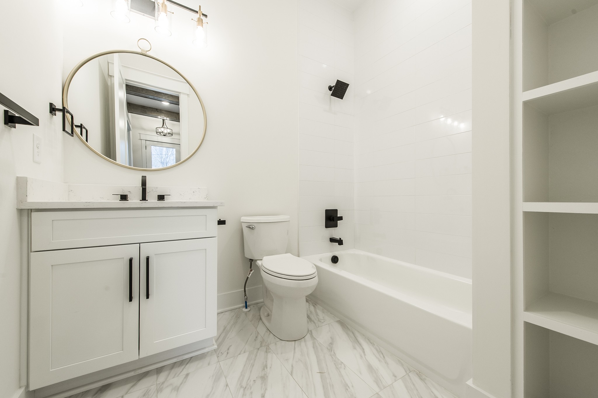 2026 Beaver Ridge Road Burns, TN 37029 - Photo 27 of 45 a bathroom with a toilet a sink and a bathtub