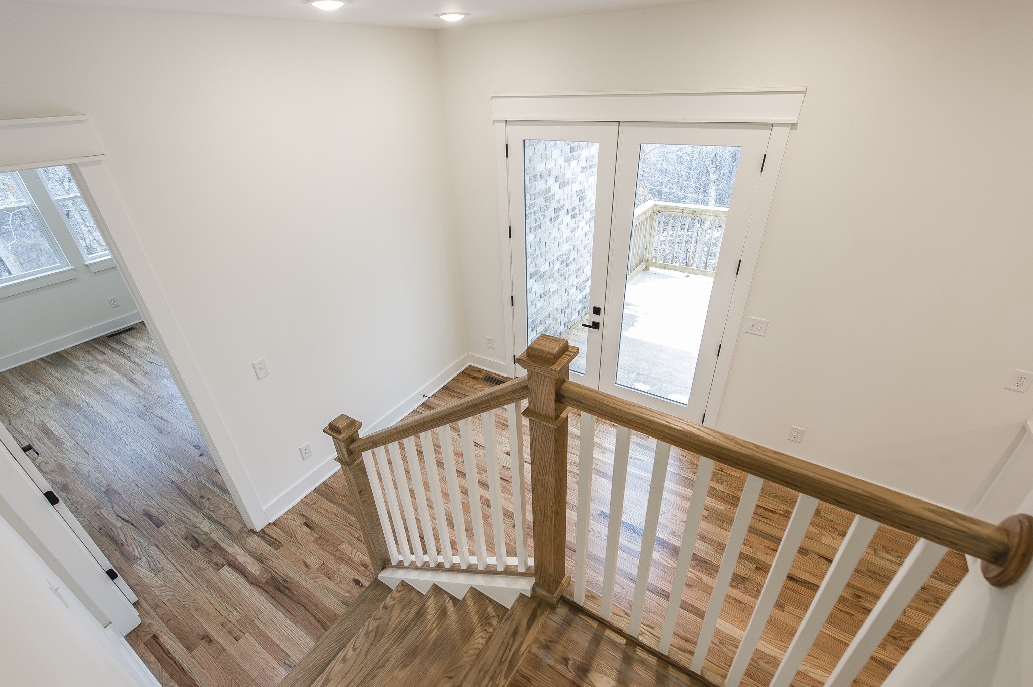 2026 Beaver Ridge Road Burns, TN 37029 - Photo 39 of 45 a view of a hallway with wooden floor and staircase