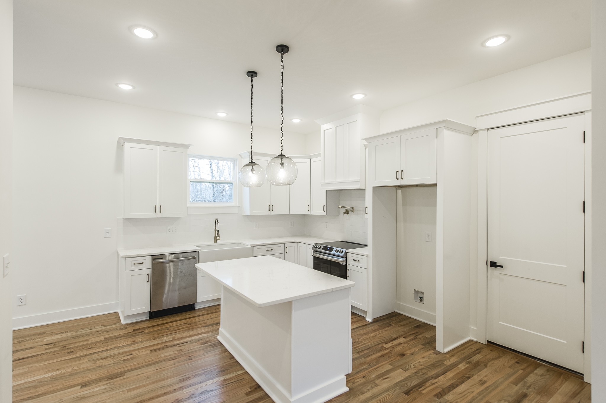 2026 Beaver Ridge Road Burns, TN 37029 - Photo 7 of 45 a kitchen with a sink a counter top space stainless steel appliances and cabinets
