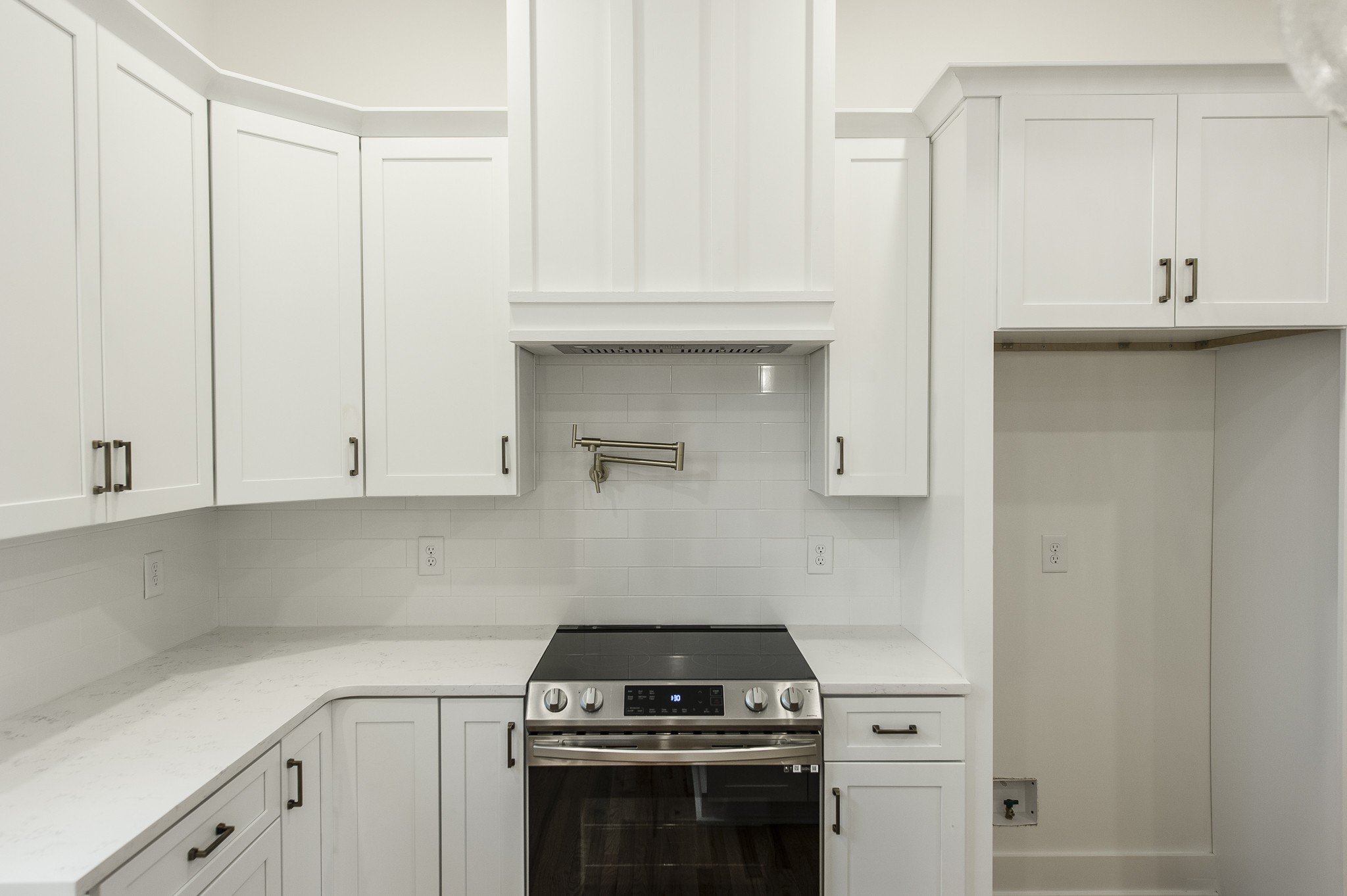 2026 Beaver Ridge Road Burns, TN 37029 - Photo 10 of 45 a kitchen with granite countertop white cabinets and stainless steel appliances