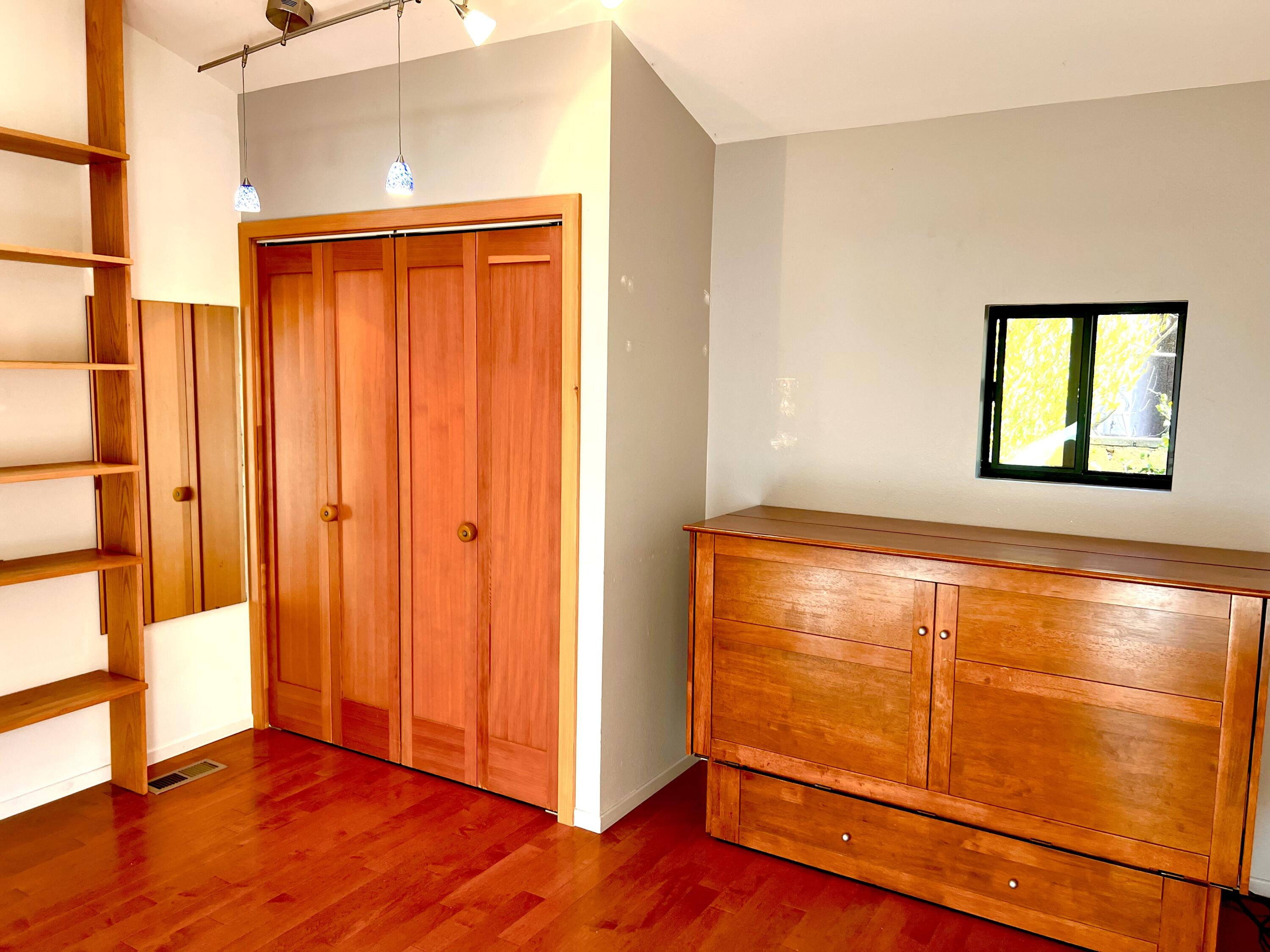 822 Chelham Way Montecito, CA 93108 - Photo 4 of 10 a view of an empty room with window and wooden floor