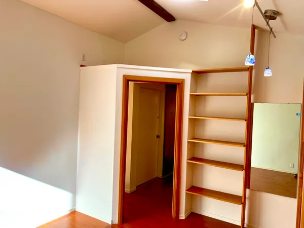 a view of an empty room and window