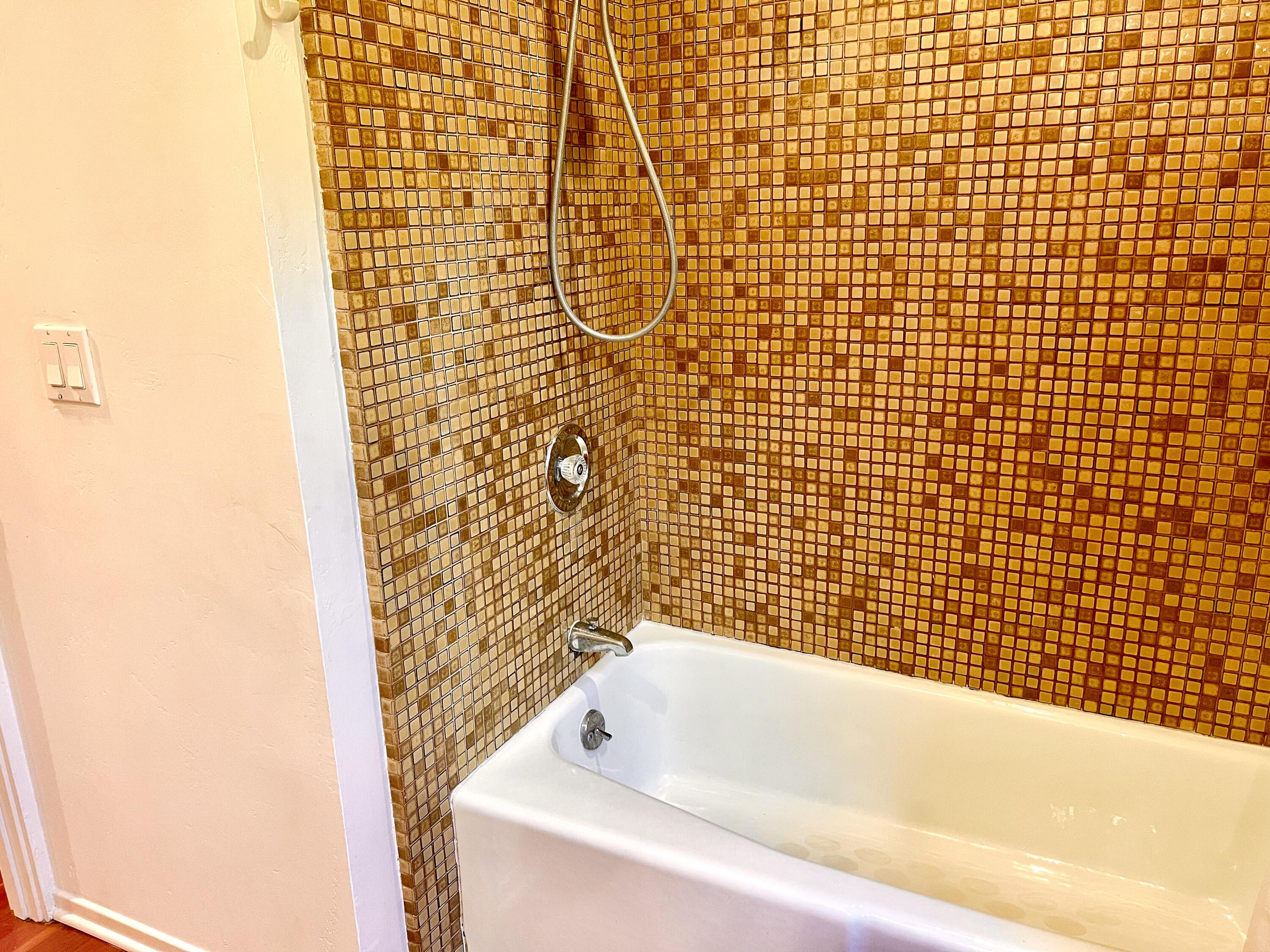 822 Chelham Way Montecito, CA 93108 - Photo 9 of 10 a bathroom with a bathtub and shower