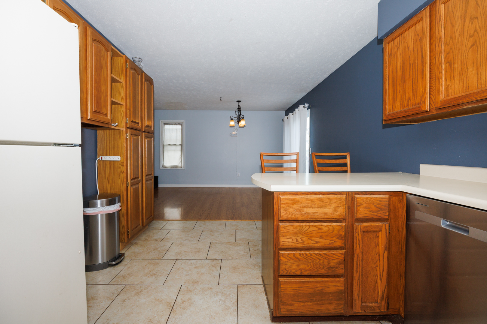 107 Regal Drive Normal, IL 61761 - Photo 13 of 41 a kitchen with stainless steel appliances granite countertop a refrigerator and a stove