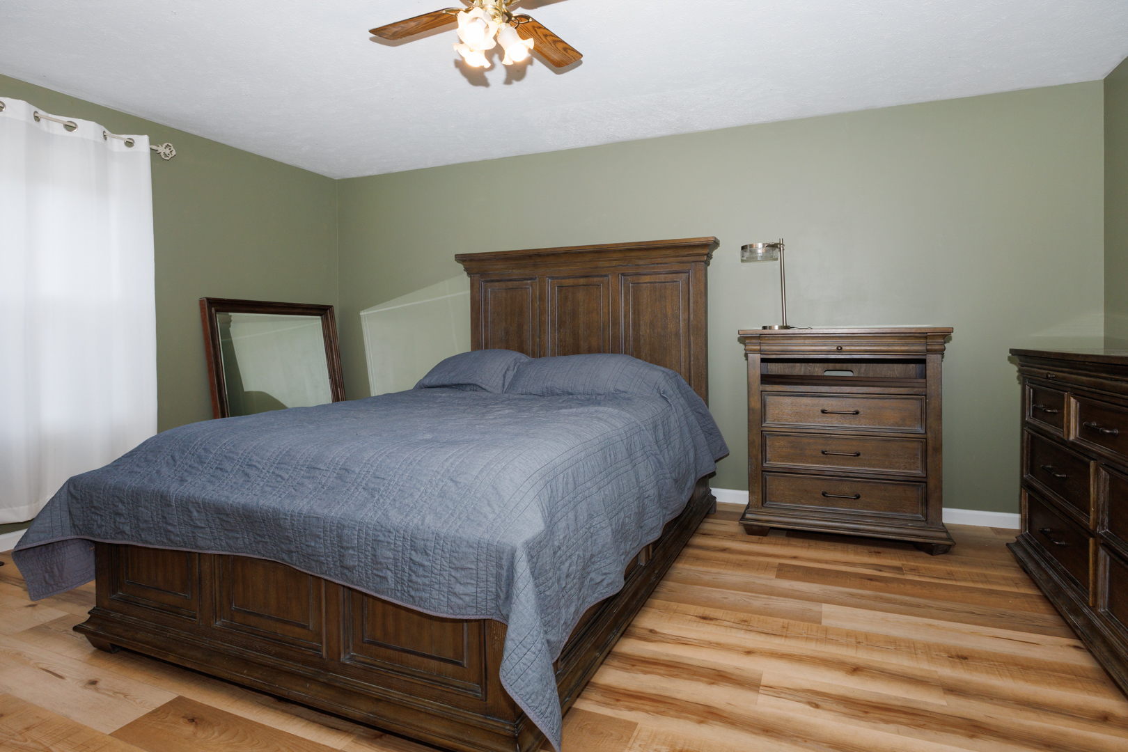 107 Regal Drive Normal, IL 61761 - Photo 18 of 41 a bedroom with a bed and wooden floor