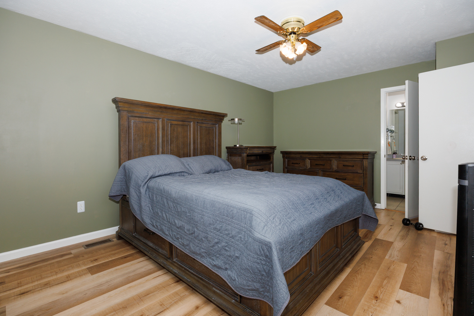 107 Regal Drive Normal, IL 61761 - Photo 19 of 41 a bedroom with a bed and a chandelier