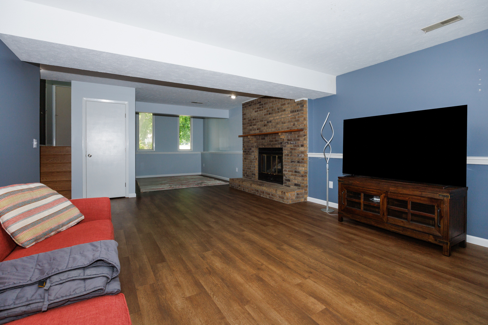 107 Regal Drive Normal, IL 61761 - Photo 28 of 41 a living room with furniture and a flat screen tv