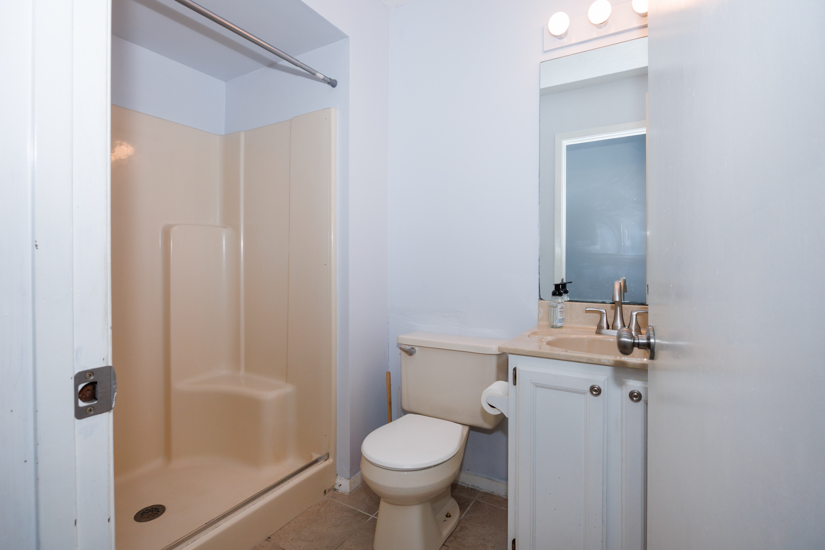 107 Regal Drive Normal, IL 61761 - Photo 30 of 41 a bathroom with a granite countertop toilet a sink and a mirror