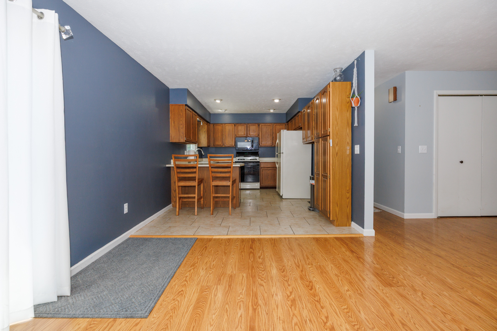 107 Regal Drive Normal, IL 61761 - Photo 8 of 41 a view of dining room with furniture and wooden floor