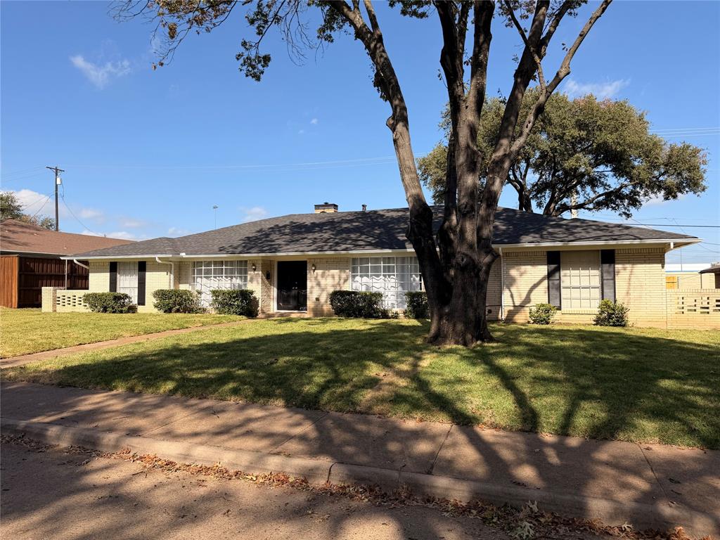 4737 Thunder Road Dallas, TX 75244 - Photo 2 of 17 a front view of a house with a yard
