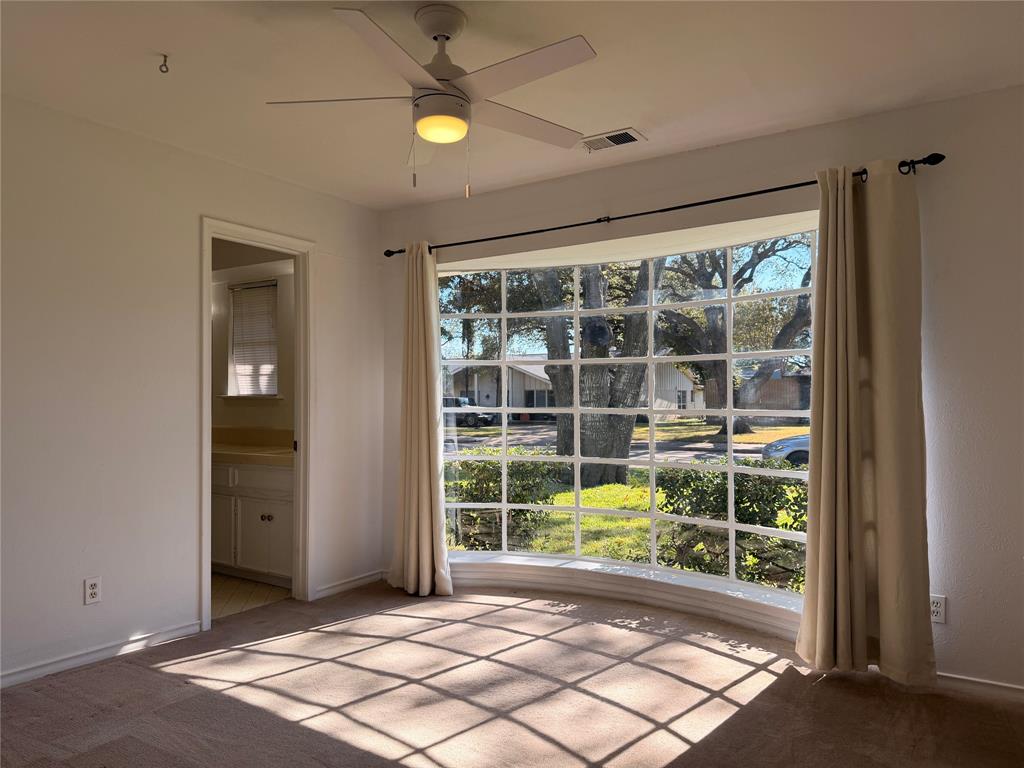 4737 Thunder Road Dallas, TX 75244 - Photo 4 of 17 a view of a room with window and ceiling fan