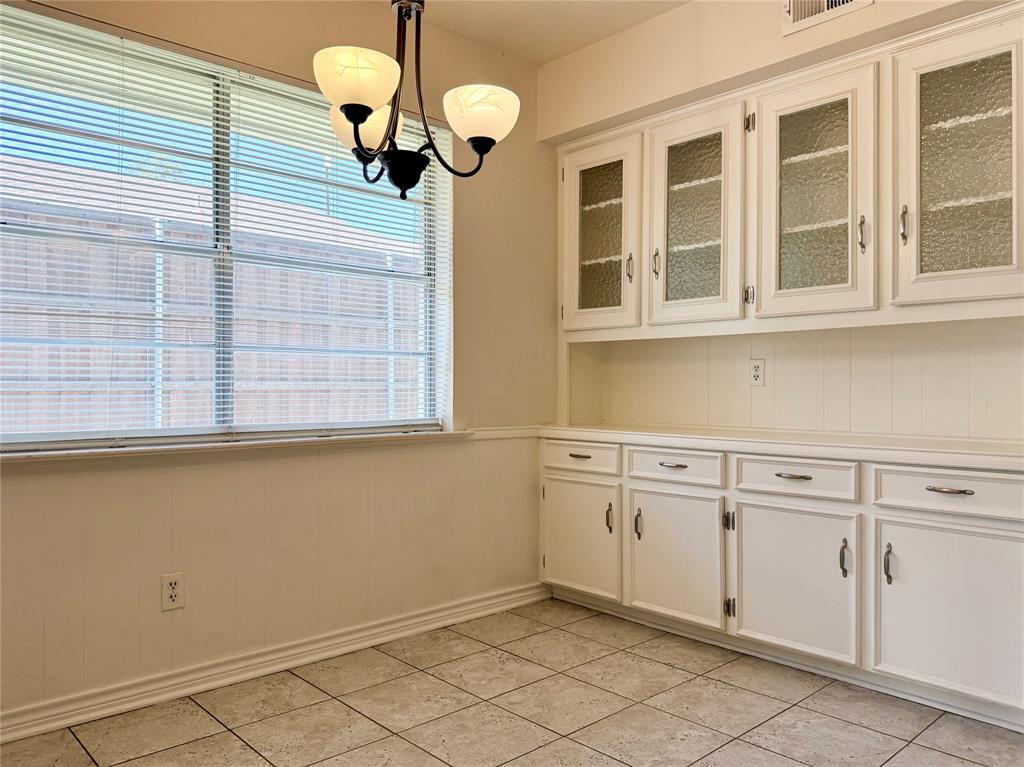 4737 Thunder Road Dallas, TX 75244 - Photo 8 of 17 a kitchen with a cabinets and chandelier