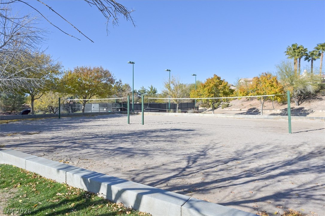 1259 Moon Vision Street Henderson, NV 89052 - Photo 47 of 53 Enjoy outdoor recreation with a well-maintained sand volleyball court, perfect for active living.