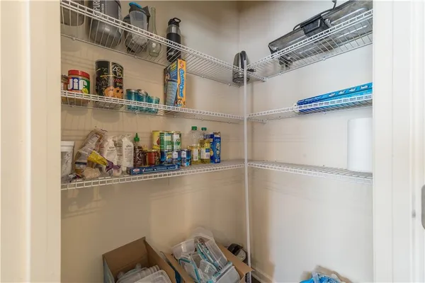 a view of storage and utility room with racks on the wall