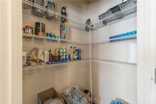 a view of storage and utility room with racks on the wall