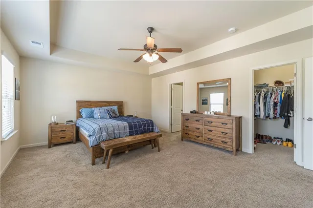 a bedroom with furniture and window