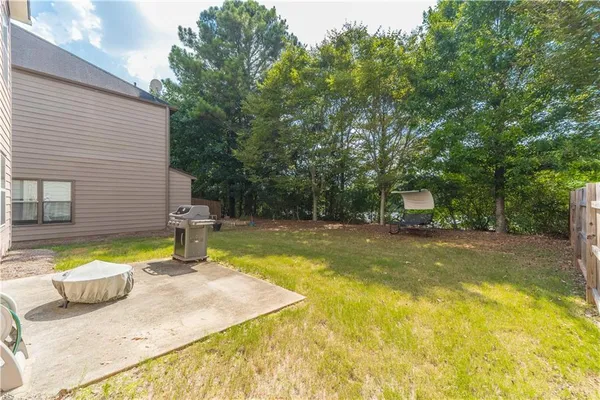 a view of a swimming pool with a patio
