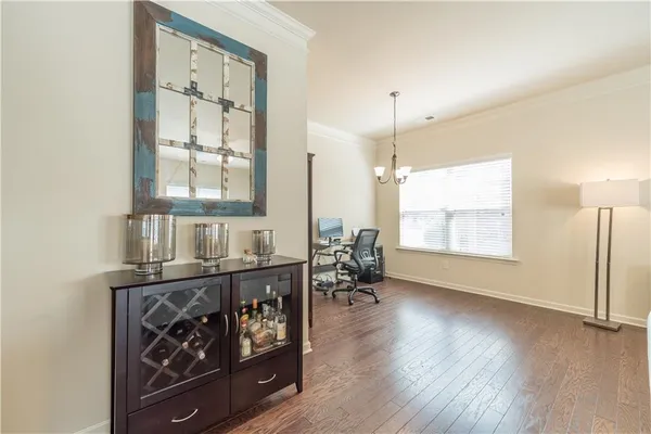 a view of a room with gym equipment and windows