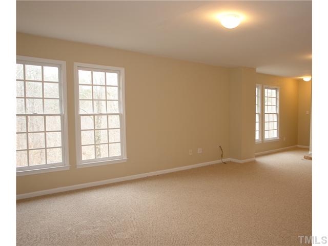 2808 Sunnystone Way Raleigh, NC 27613 - Photo 17 of 21 an empty room with windows