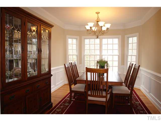 2808 Sunnystone Way Raleigh, NC 27613 - Photo 9 of 21 a view of a dining room with furniture and windows