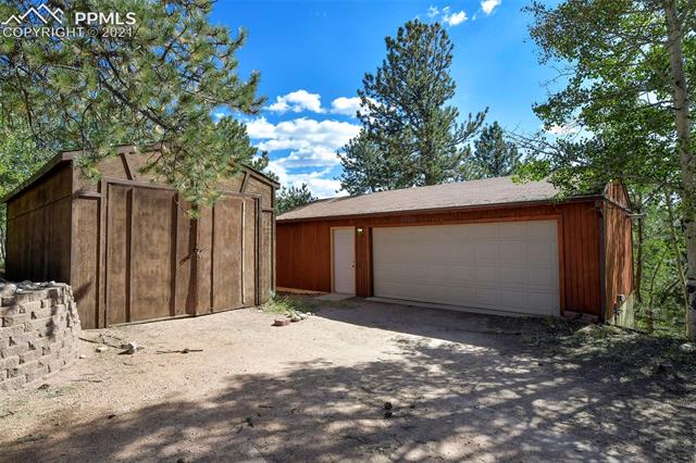 186 Wayward Wind Road Divide, CO 80814 - Photo 2 of 9 Extended 2 Card garage with workshop and back wall of windows and RV Garage
