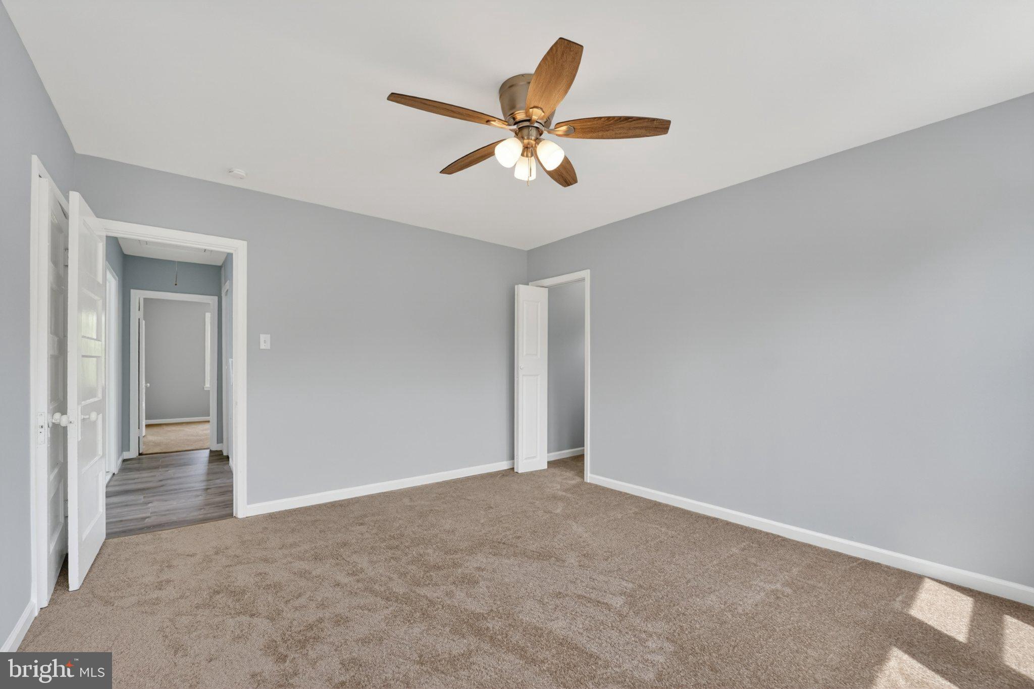 5312 Catalpha Road Baltimore, MD 21214 - Photo 48 of 59 a view of a livingroom with a ceiling fan and window