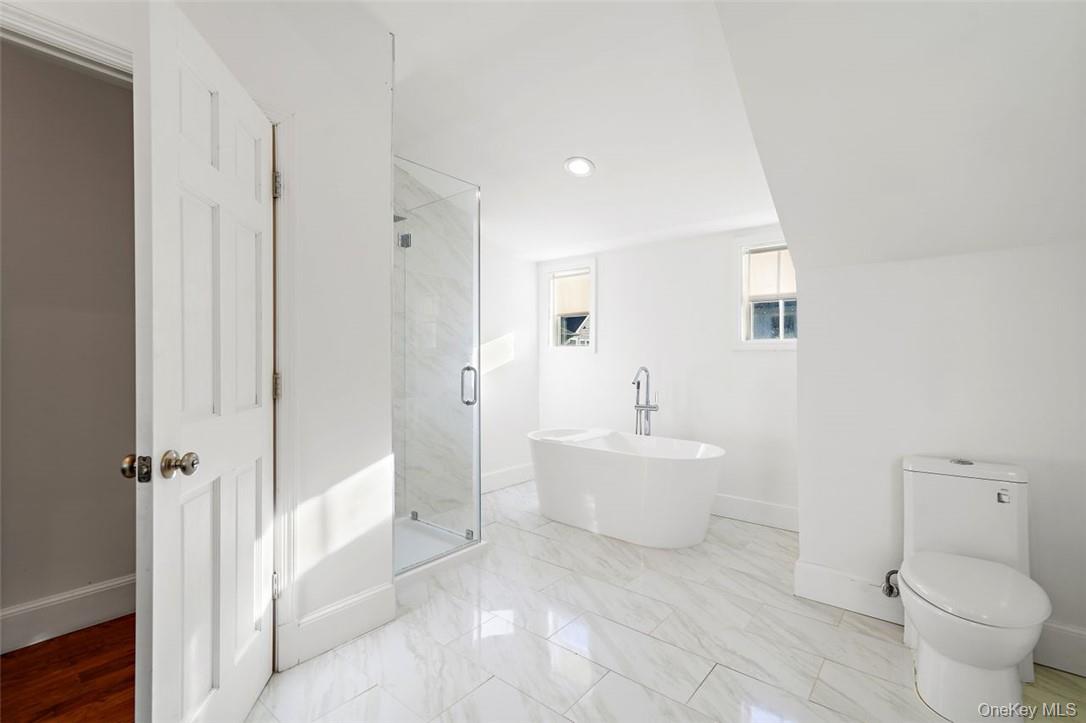 246 Mamaroneck Road Scarsdale, NY 10583 - Photo 32 of 35 Primary bathroom with shower and soaking tub