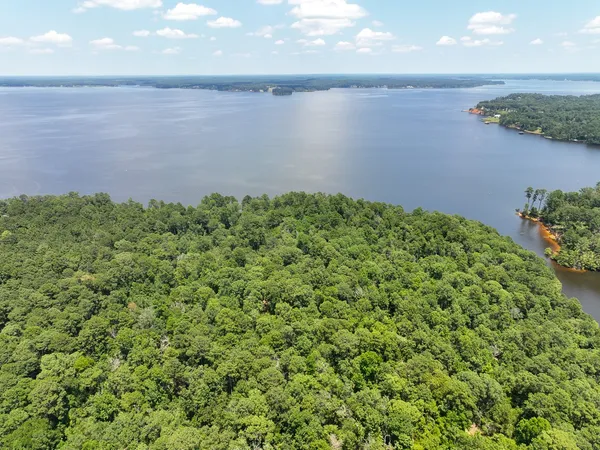 a view of a lake with a yard
